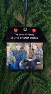 A picture of the family hanging on a tree.