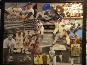 A baseball player 's wall of photos and memorabilia.